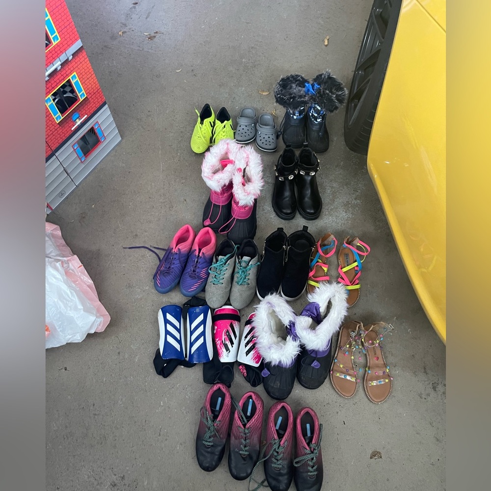 Bundle of kids shoes and snow boots